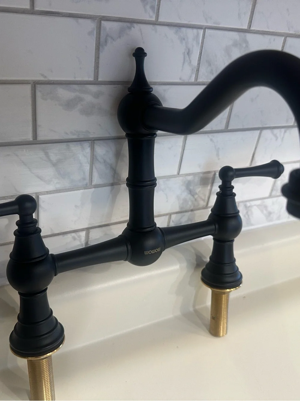 Matte Black Bridge Kitchen Faucet with Brass Accent